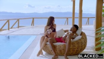 Ebony hottie takes two long white cocks on couch